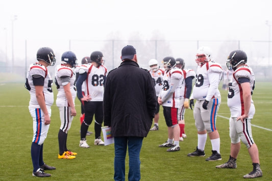 players-with-coach-discussing-strategy-together