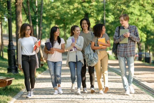 multiethnic-group-young-cheerful-students-walking