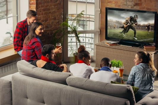 excited-group-people-watching-american-football-sport-match-home